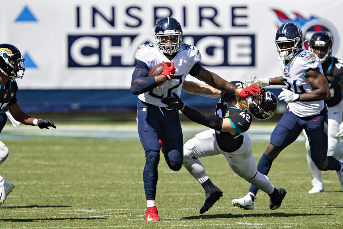 A stiff-arm from Henry—here in Week 2, plowing Jaguars safety Andrew Wingard—is a blast from the game's past.